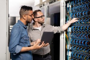 Computer support specialists analyzing network problem