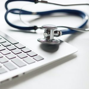 Stethoscope on the laptop keyboard. Medicine concept.
